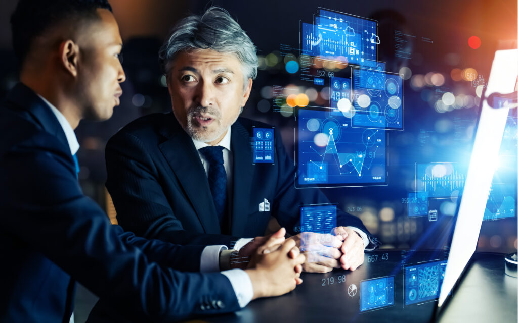 Geschäftsperson in einem modernen Büro, umgeben von digitalen Transformationstools wie ERP, Cloud, AI und UX-Designs – symbolisiert Zukunftstechnologien im Business